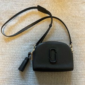 Marc Jacob’s “Shutter Crossbody Bag” in black